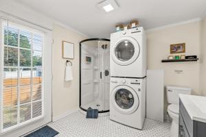 a bathroom with a washing machine and a washer at Hygge High Point by Rather Be Properties in High Point +28 photos