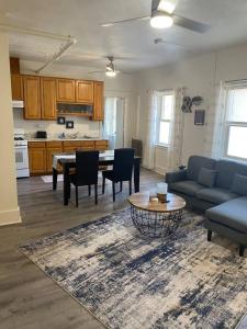 a living room with a couch and a table at 216 The Governors Suite at The George in Klamath Falls