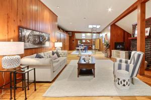 a living room with a couch and a table at Captain's Quarters on Lafayette in Savannah