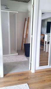 a door leading into a room with a staircase at Mary's House in Angra do Heroísmo +5 photos