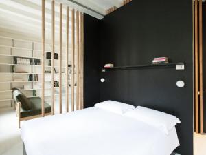 Posteľ alebo postele v izbe v ubytovaní Concoct Milano