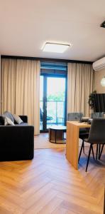 a living room with a couch and a table at EASY RENT- Szeligowskiego 15 Chodźki Residence, Free Parking, 24h Check-in in Lublin