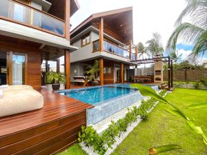 an image of a house with a swimming pool at Hura Vilas in Itarema