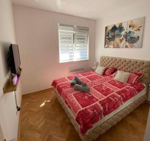 Ένα ή περισσότερα κρεβάτια σε δωμάτιο στο Apartman Sunny, Vrnjacka Banja