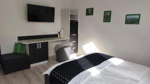 Postel nebo postele na pokoji v ubytování Darázshegyi Panzió gluténmentes félpanzióval is