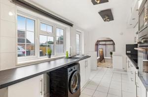 a kitchen with a washer and dryer in it at 2-Bed Near Lincoln City Centre with Parking in Lincoln