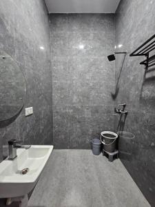 a bathroom with a sink and a toilet at JASMIN a luxury stay in Agra