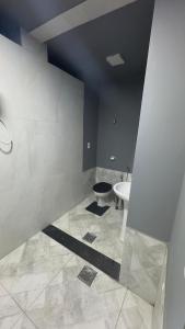a bathroom with a toilet and a sink at Rooftop Studio Premium in Bom Despacho +5 photos