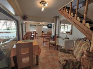 a living room with a couch and a table at Hostal Casa Familia in Santa Cruz
