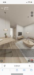a rendering of a living room with a table and a tv at Wings apartman Kittima in Amphoe Koh Samui