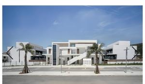 a rendering of a building with palm trees in front at Casa Bakara La Brisa Zahara Beach in Zahara de los Atunes