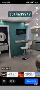a living room with a counter and a chair at Suite dolce amore spa & relax in Venosa