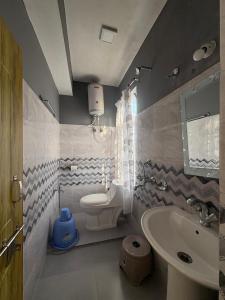 a bathroom with a sink and a toilet at NOLINA BOUTIQUE HOMESTAY in Namchi +19 photos