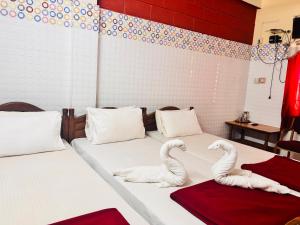 Ένα ή περισσότερα κρεβάτια σε δωμάτιο στο Katyayani residency gokarna +16 φωτογραφίες