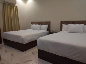 Postel nebo postele na pokoji v ubytování NEMES Pyramids View INN