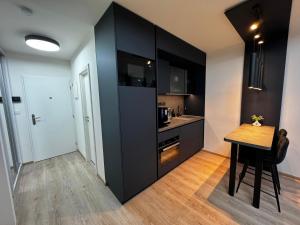 Η κουζίνα ή μικρή κουζίνα στο Smarty Choice Living with Netflix - Kubánské náměstí