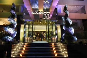 a store front with stairs in front of it with lights at Warwick Stone 55 Hotel Beirut in Beirut