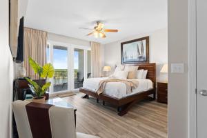 a bedroom with a bed and a ceiling fan at Laketown Wharf 933 in Panama City Beach +61 photos