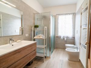 a bathroom with a sink and a toilet at Podere Limeria Country Home nelle Marche in Fermignano +67 photos