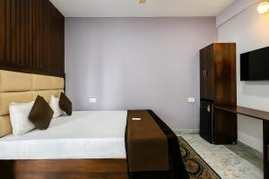 Ένα ή περισσότερα κρεβάτια σε δωμάτιο στο Akshata Residency at Goa +2 φωτογραφίες