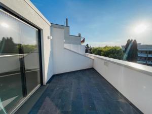 a balcony with a view of the city at NAMA STAY Bed and breakfast in Adelfia