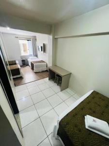 Postel nebo postele na pokoji v ubytování Hotel Zata - Econômico