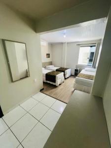 Postel nebo postele na pokoji v ubytování Hotel Zata - Econômico