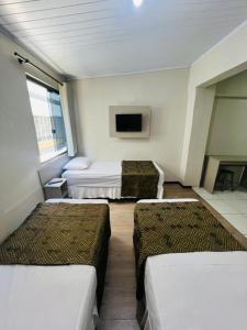 Postel nebo postele na pokoji v ubytování Hotel Zata - Econômico + 97 fotografií