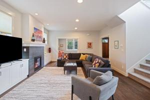 a living room with a couch and a fireplace at Hillside Haven in Bend