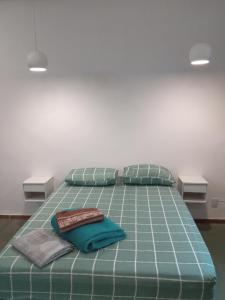 Una cama o camas en una habitación de Apartamento 501