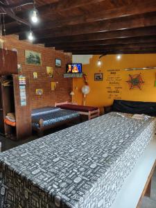 a bedroom with a large bed in a room at El Paraíso in Necochea