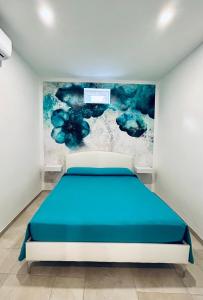 Un pat sau paturi într-o cameră la Casa del Sole
