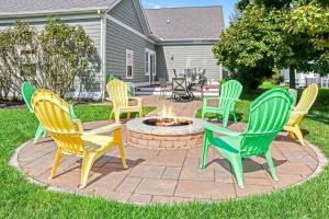a group of chairs sitting around a fire pit at All In at Trailside - Community Pool Fire Pit Game Room Nature Trails in South Haven