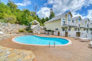 a swimming pool in front of a house at Private Boat Slip, Scenic Views Norris Lake Condo in Alder