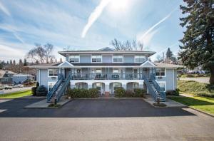 a large blue house with a porch at 08 Lodge in Hood River