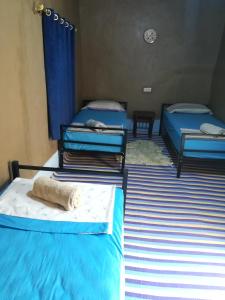 Postel nebo postele na pokoji v ubytování Gite Amoudou