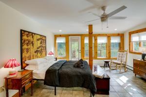 a bedroom with a bed and a ceiling fan at Secluded Family Getaway with On-Site Creek in Hawley in Hawley