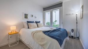 Una cama o camas en una habitación de 1BDR Tróia Beach House by LovelyStay