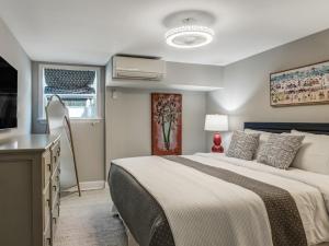 a bedroom with a large bed and a dresser at Beachside Villa Collection - 6 Bedroom in Tybee Island +47 photos