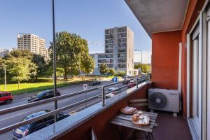 a balcony with a table and a view of a highway at Maison Prince Milano in Milan