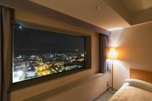 Postel nebo postele na pokoji v ubytování Yokohama Techno Tower Hotel