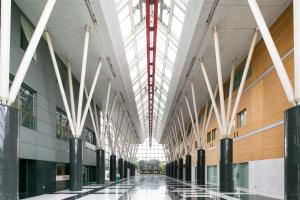 an empty hallway in a building with skylights at Yokohama Techno Tower Hotel in Yokohama