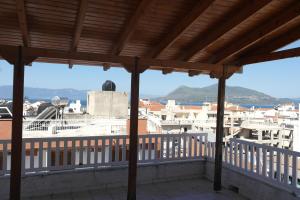 a view from the balcony of a building at Eleni's Rooms in Loutra Edipsou