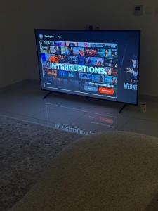 a flat screen tv sitting on top of a table at Sea and lake view apartment in Muscat +2 photos