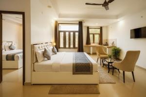 Gallery image of Holiday In , Vrindavan #Big Swimming Pool #luxury Rooms # Lush Garden # Family Friendly # Kids Play Zone # Calm & Spiritual Vibes # Away From City Hustle# By elegance group# in Vrindāvan