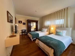 En eller flere senge i et værelse på Casa de Gouvães Turismo Rural Douro + 56 billeder