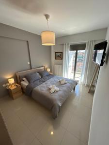 Ένα ή περισσότερα κρεβάτια σε δωμάτιο στο Grand Stay Edessa