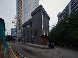 a building on the side of a city street at Hotel Stayre in Incheon