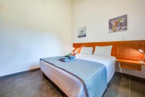 a bedroom with a large bed in a room at Iris Apartment in Potrero +27 photos