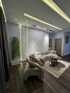 a living room with a couch and a table at AmandaHome in Lekki